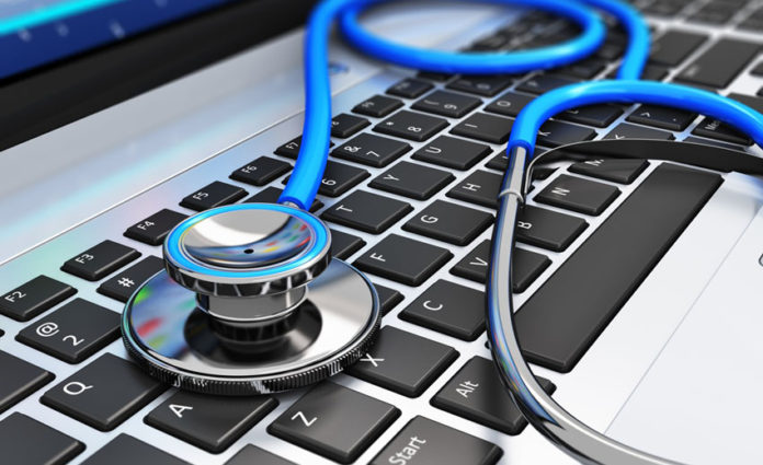 Stethoscope on laptop keyboard